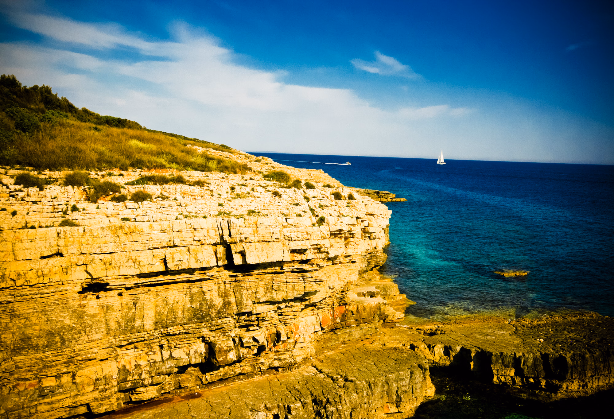Dramatic cliffs and turquoise sea at Kamenjak Nature Park, Istria